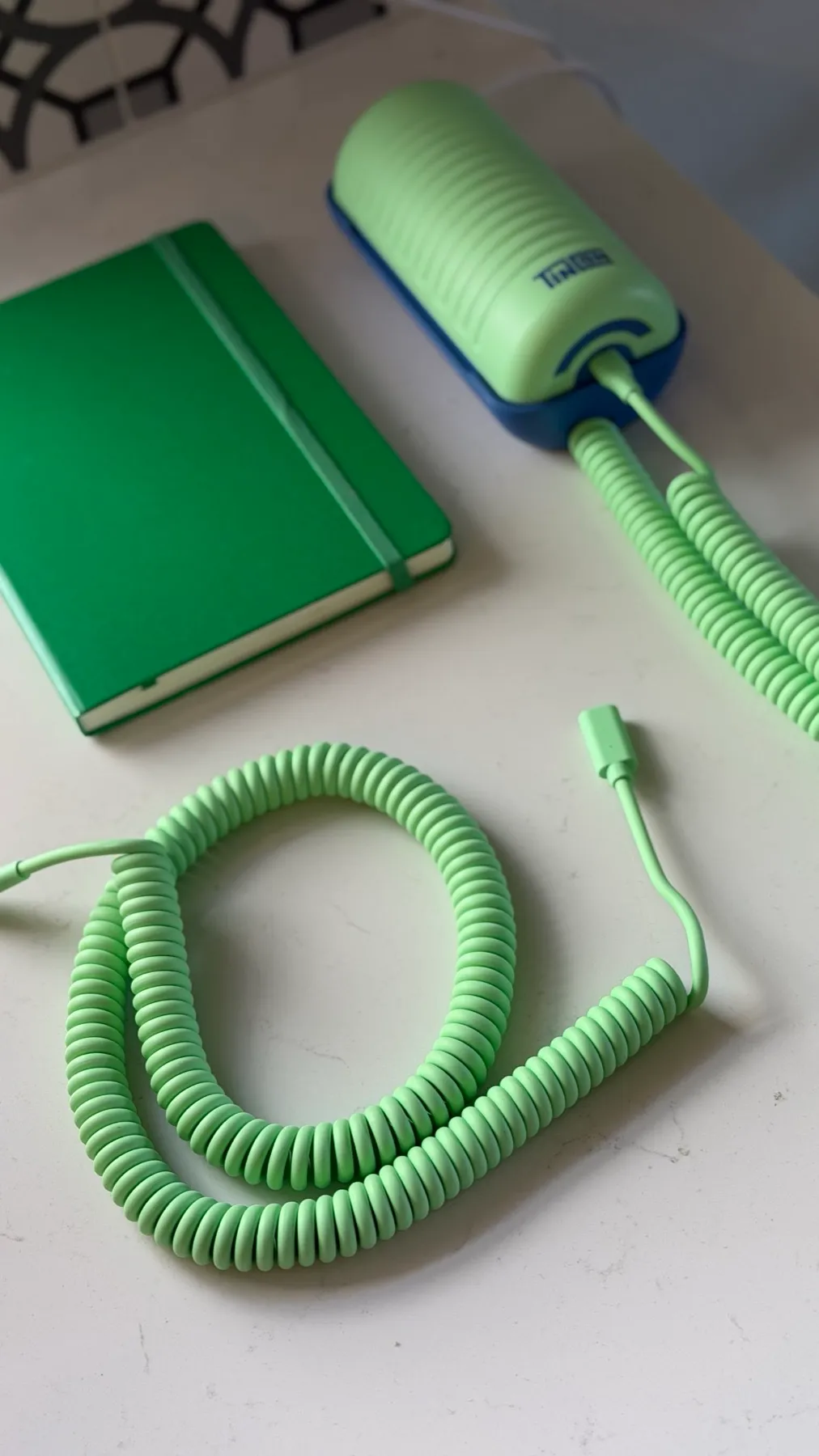 The replacement coiled cord next to our Tin Can