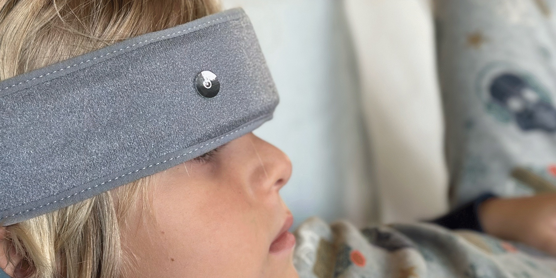 My son resting with the SONU Band on his forehead during an evening session