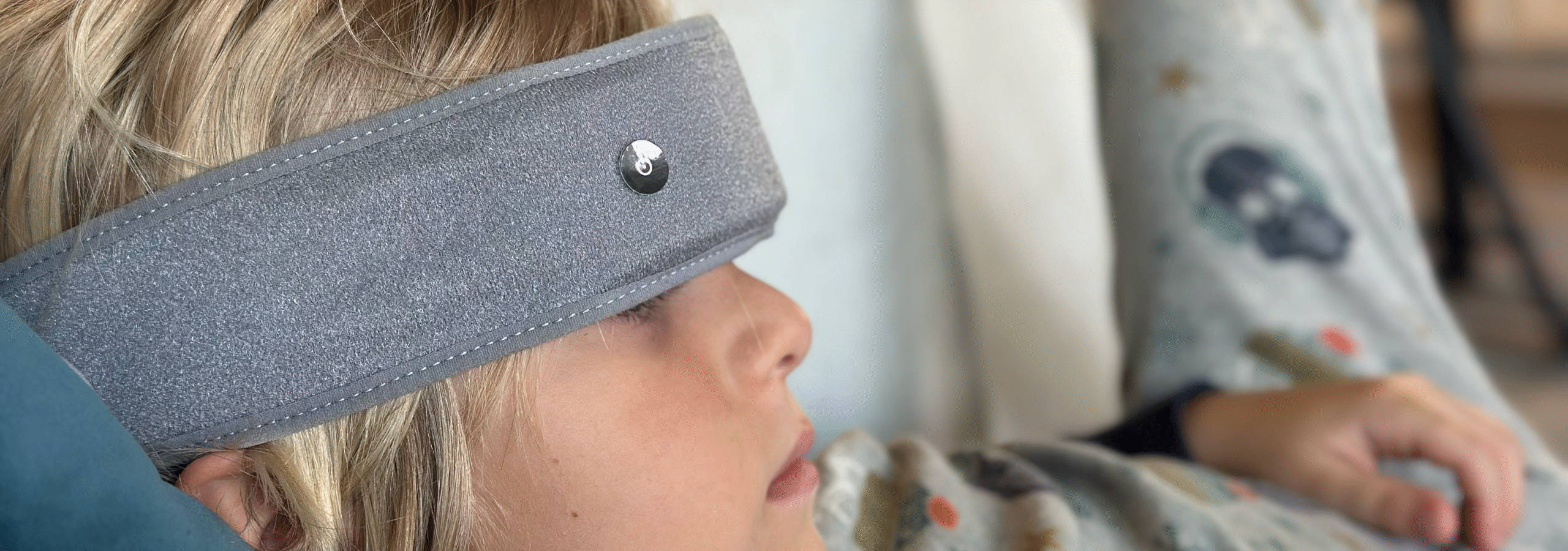 My son resting with the SONU Band on his forehead during an evening session