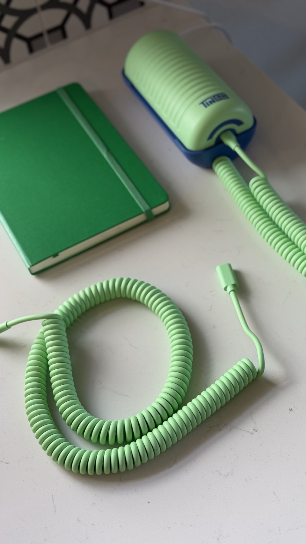 The replacement coiled cord next to our Tin Can